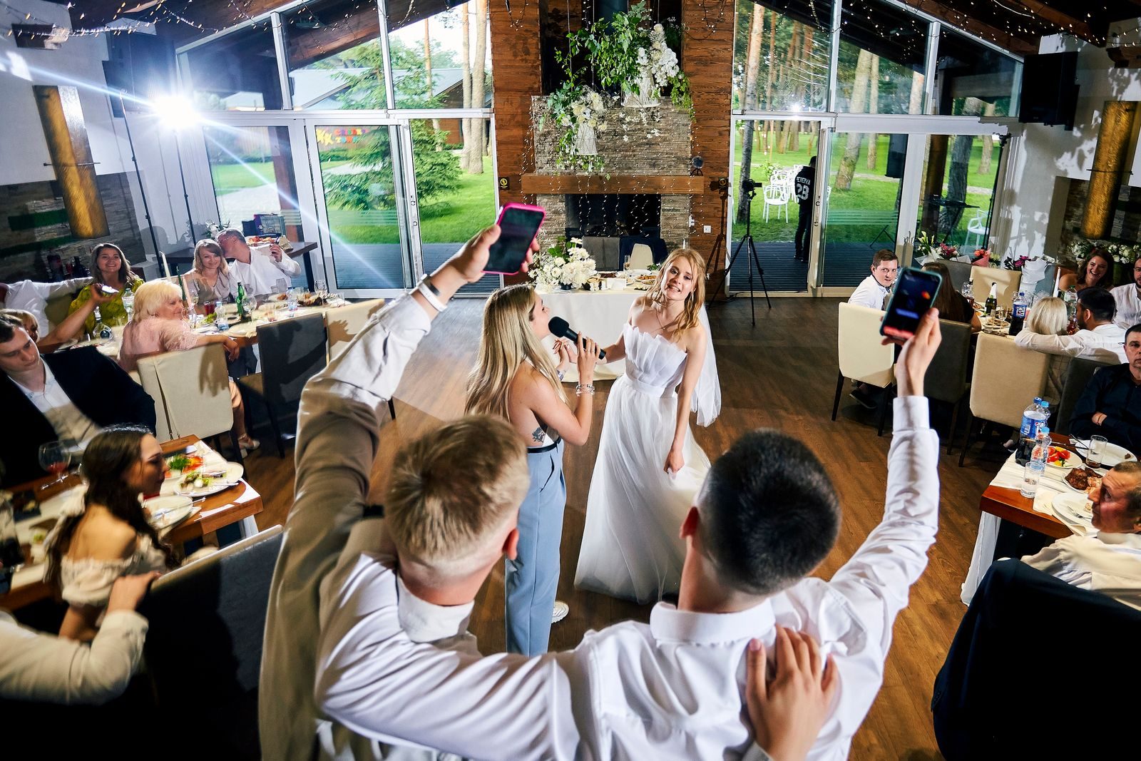 Wedding guests celebrating around the bride during a reception